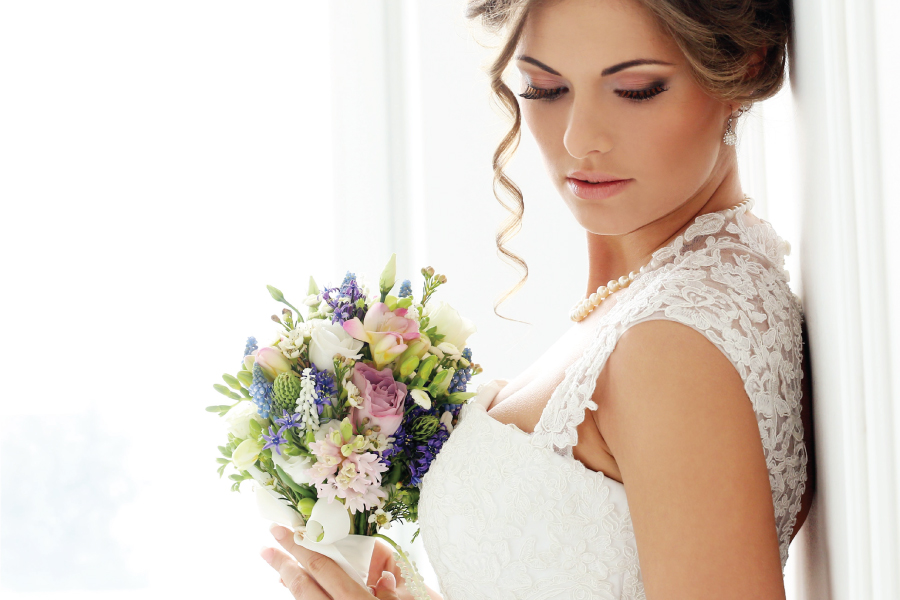 bride with colored flowers