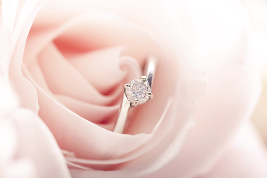A wedding ring in a rose